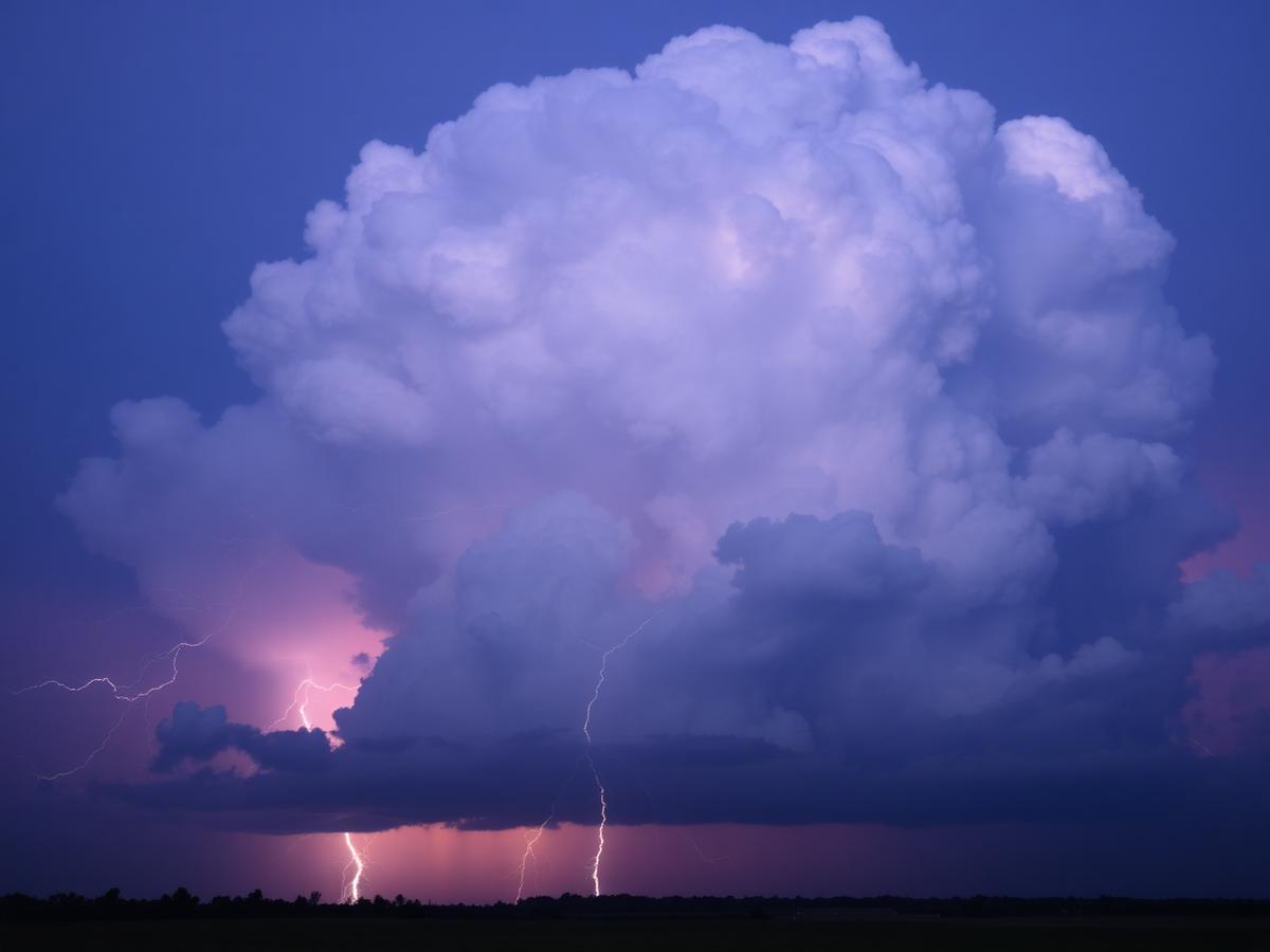 Multiple bolts under a towering cumulonimbus